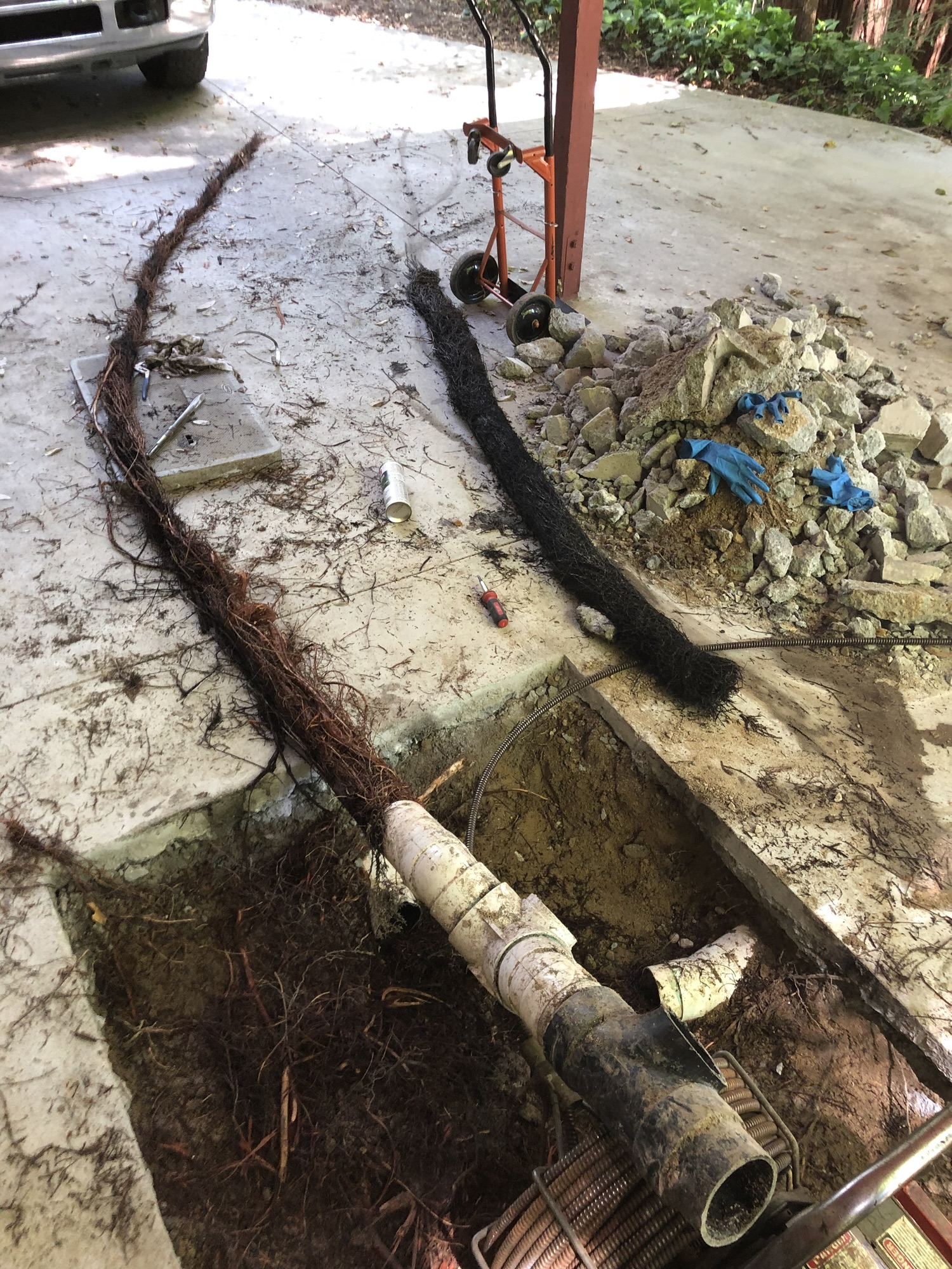 Plumber installing a tankless water heater in a Santa Cruz County home, showcasing expertise in efficient water heating solutions.